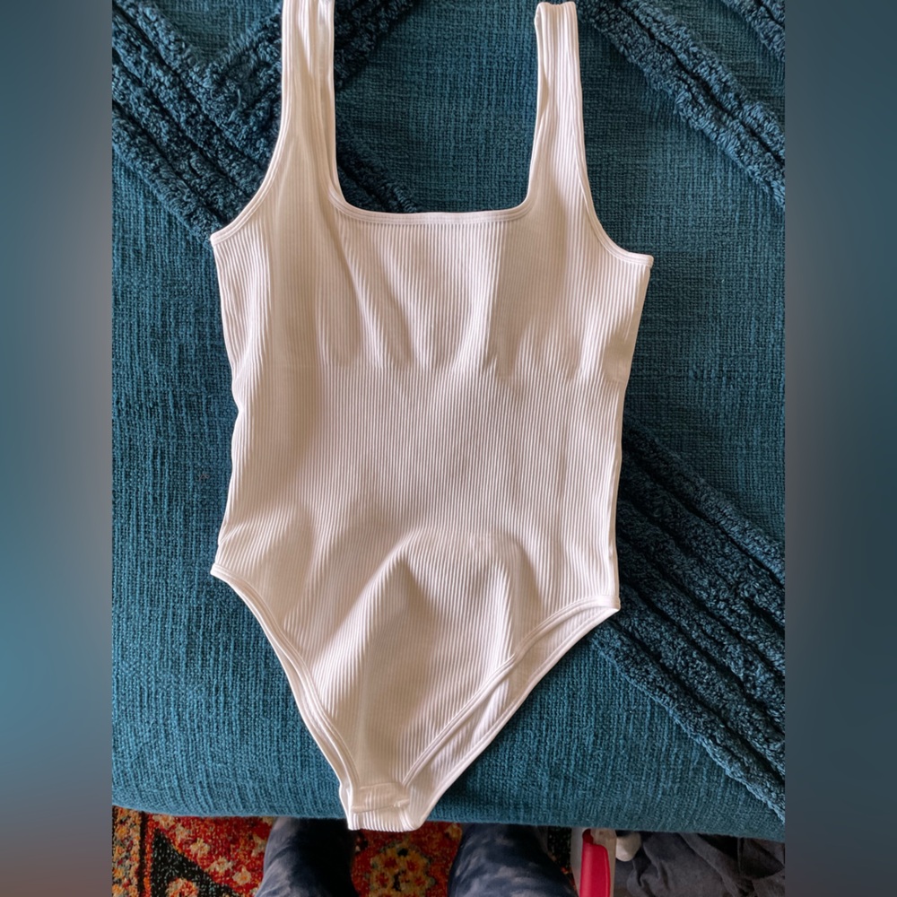 Cream body suit that makes you look snatched